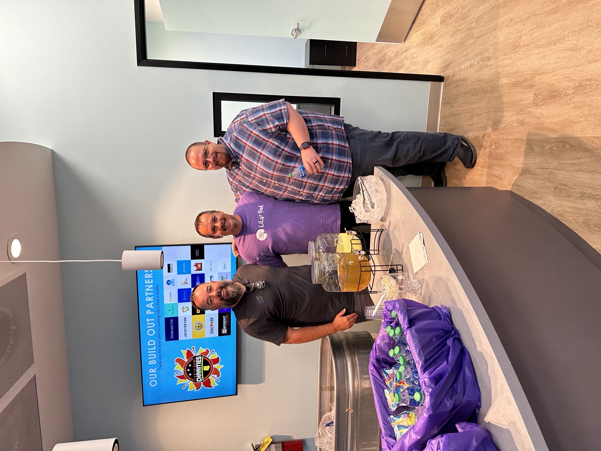 Frank Garza, Program Manager at TD SYNNEX, poses with colleagues in the kitchen of the Gilbert, Arizona office.