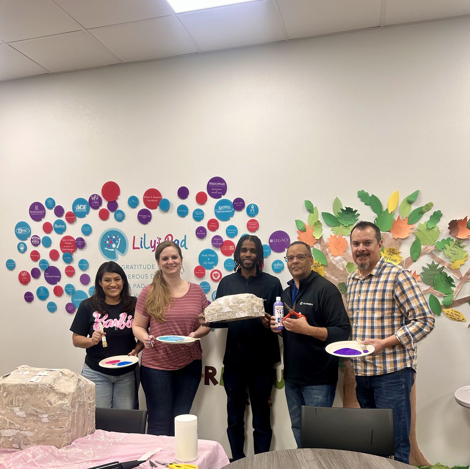 Frank Garza and various TD SYNNEX employees celebrate their volunteer efforts together at Lily's Pad in Gilbert, Arizona.